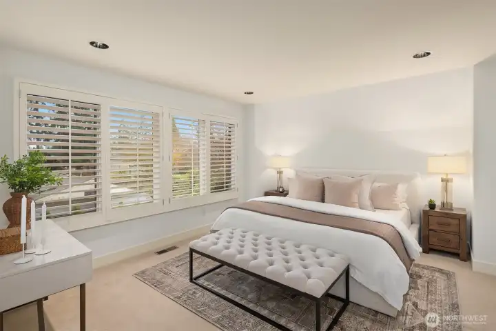 Upstairs, the spacious primary suite offers a peaceful retreat with a walk-in closet and ensuite bath with dual vanities.