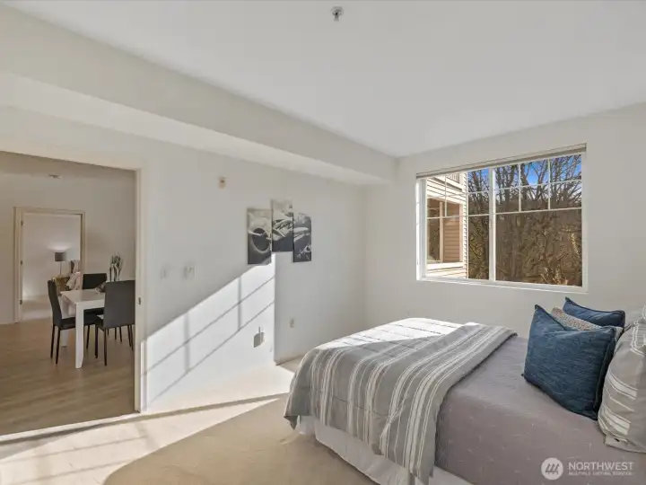 2nd bedroom with natural light and direct connection to main living areas and private ensuite, and walk in closet.