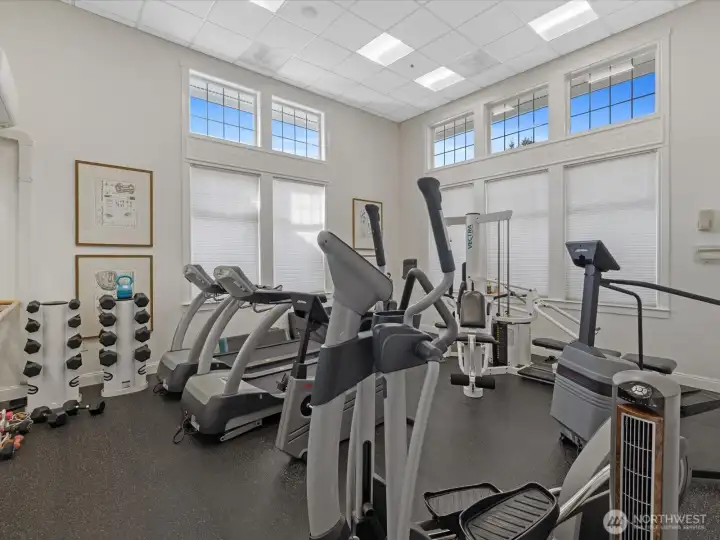 On-site fitness center with cardio equipment, free weights, and dedicated workout space within the community.