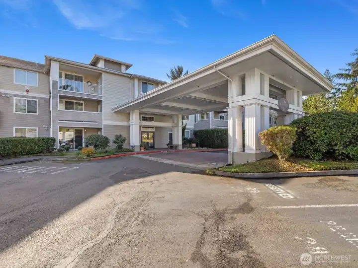 Covered entrance with ample guest parking.