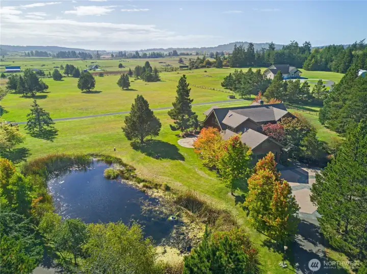 Sweeping valley views, manicured grounds, and a serene pond create an idyllic setting for this private estate just minutes from the conveniences of town.