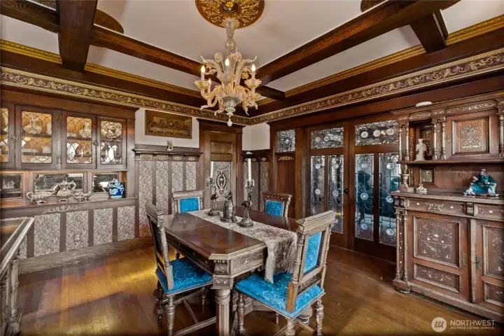 One off glass chandelier glows at night.