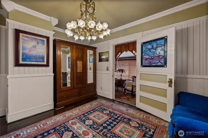 Bedroom #3 on the second floor. Open doorway leads to elevator access and large window overlooking rear of the home.