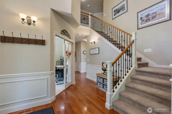 Entryway with stairs leading to bedrooms