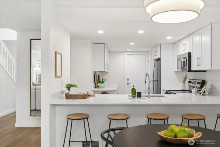 A fully redesigned kitchen with expanded prep space, abundant storage, and elevated finishes designed for everyday ease.