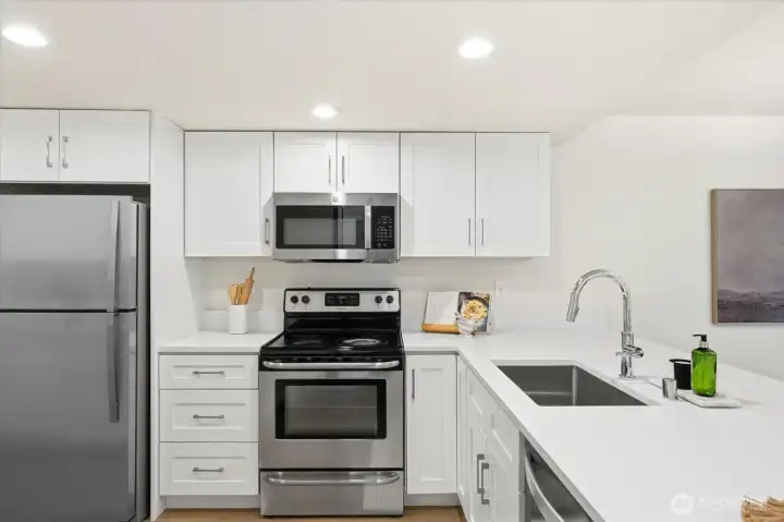 A complete kitchen transformation featuring custom cabinetry, premium 3 cm quartz countertops, and enhanced functionality throughout.