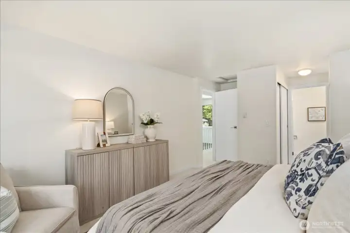 Private Retreat: Spacious primary bedroom featuring dual closets and its own designer-finished en-suite bath.