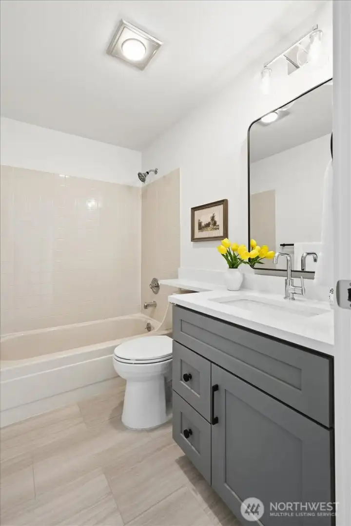 Every bathroom in the home has been elevated with new vanities, fixtures, and designer flooring.