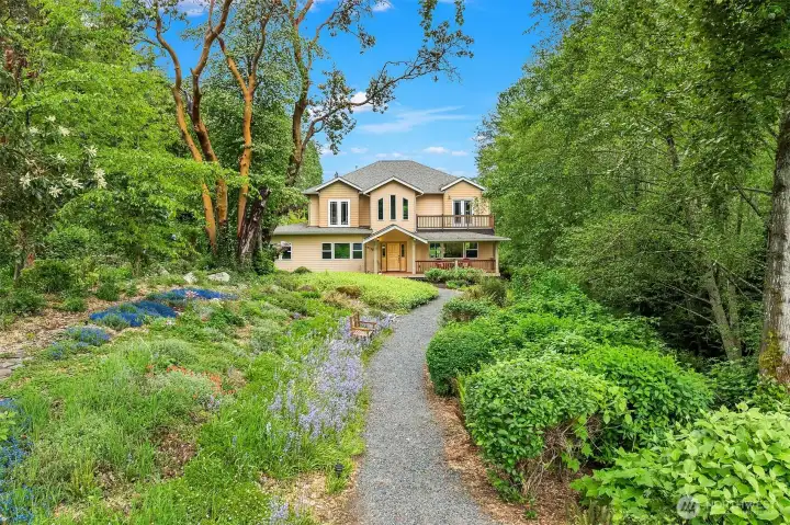 Quaint pathway leads to gorgeous custom-built home on .91 acres. Quaint pathway leads to gorgeous custom-built home on .91 acres.