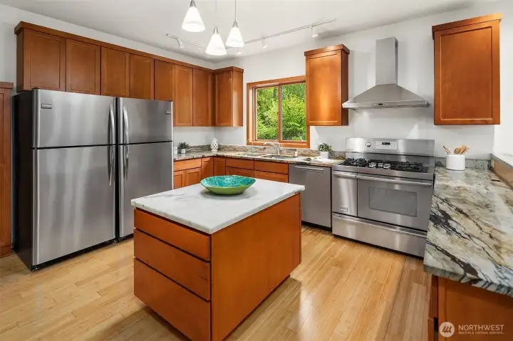 Chef's kitchen with dual refrigerators, Viking range, Miele dishwasher. Chef's kitchen with dual refrigerators, Viking range, Miele dishwasher.