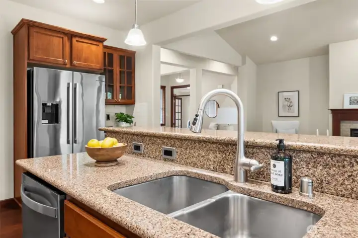 Open-concept kitchen with gorgeous granite countertops