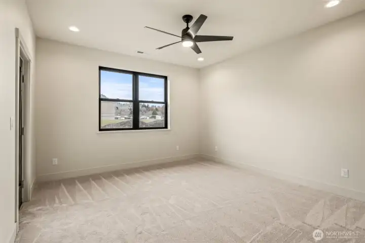 Spacious primary suite with beautiful view, en-suite bathroom, and walk-in closet