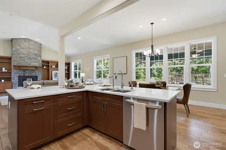 Remodeled kitchen with new quartz countertops, new solid wood soft-close cabinets, RO water, and high-end appliances opening to the main living area Remodeled kitchen with new quartz countertops, new solid wood soft-close cabinets, RO water, and high-end appliances opening to the main living area