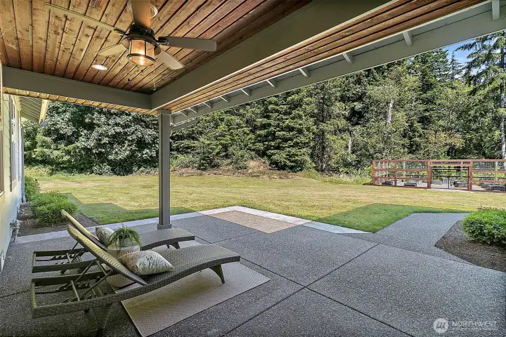 Covered back patio with wood ceiling detail, ceiling fan, and space to relax just off the main living areas. Covered back patio with wood ceiling detail, ceiling fan, and space to relax just off the main living areas.