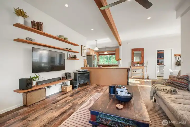 Are you already wondering what you would put on these floating shelves? This whole space is meant for living, telling tall tales, watching your favorite movies and catching up with old friends and guests. If "open concept" had a photo in the dictionary it would be this one, before the phrase became a catch all for the huge, cavernous new construction homes with zero personality. Are you already wondering what you would put on these floating shelves? This whole space is meant for living, telling tall tales, watching your favorite movies and catching up with old friends and guests. If "open concept" had a photo in the dictionary it would be this one, before the phrase became a catch all for the huge, cavernous new construction homes with zero personality.