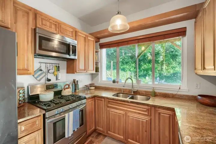 The gas stove is fantastic, but really, look at the view out the kitchen window! It already elevates whatever it is you've got cooking. The gas stove is fantastic, but really, look at the view out the kitchen window! It already elevates whatever it is you've got cooking.