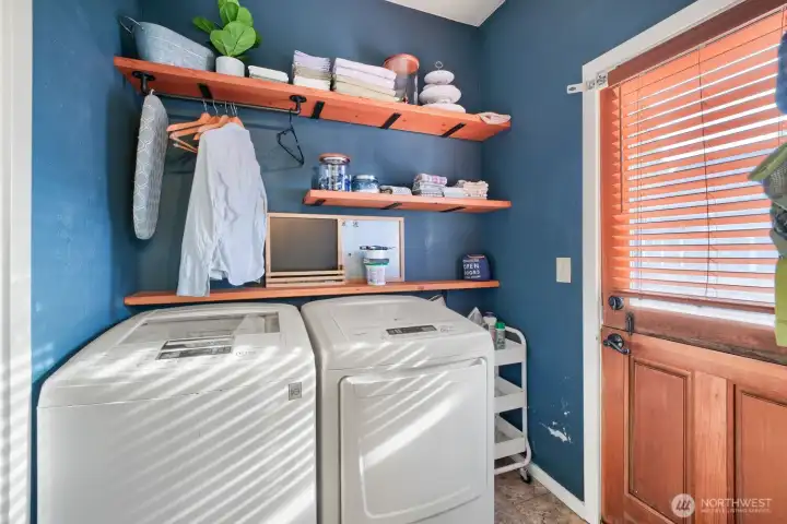 The laundry room is just off the 3/4 bath and the door here leads to the covered back deck. The laundry room is just off the 3/4 bath and the door here leads to the covered back deck.