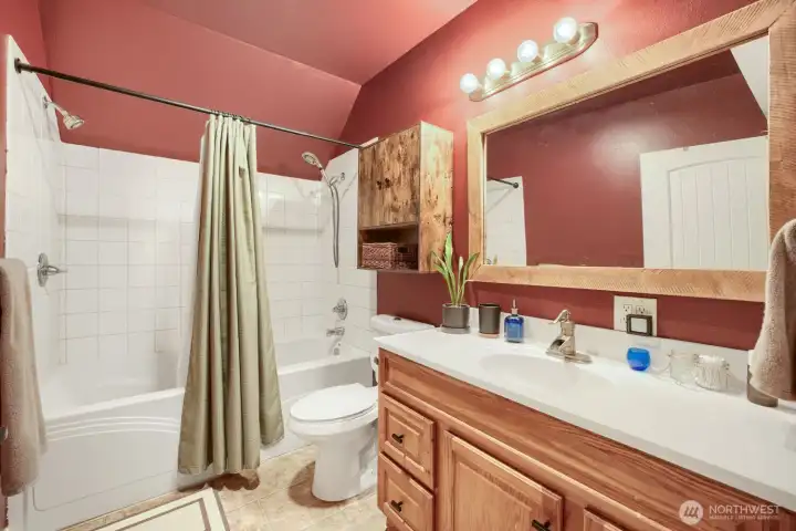 This is the dramatic upstairs bath. The sellers committed to the color. It was a bold move AND it really works in this space. This is the dramatic upstairs bath. The sellers committed to the color. It was a bold move AND it really works in this space.