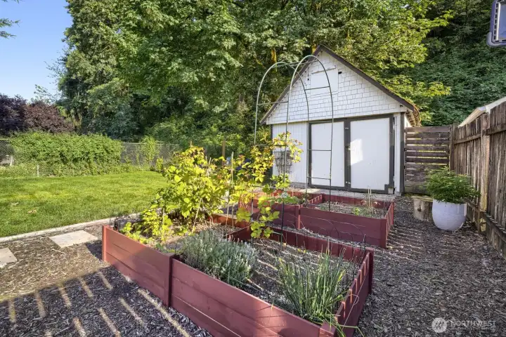 Raised beds here already have you started on berries and herbs. Looking for more garden space? There is plenty of room. Raised beds here already have you started on berries and herbs. Looking for more garden space? There is plenty of room.
