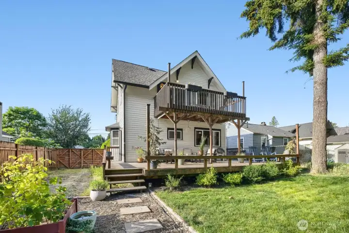 The outside spaces here are off the charts. Deck up top, entertainment deck below, cushy green grass yard with fire pit, garden beds, detached garage for projects and hobbies. Park in front or behind the gate. The outside spaces here are off the charts. Deck up top, entertainment deck below, cushy green grass yard with fire pit, garden beds, detached garage for projects and hobbies. Park in front or behind the gate.