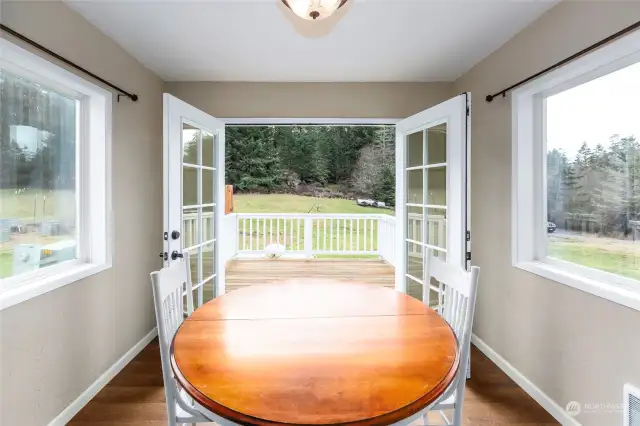 Bright and sunny breakfast/dining area directly off kitchen with French doors to the deck. Perfect for those spring, summer fall outdoor dining.