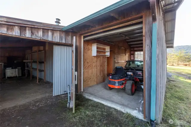 3 car detached garage has shop, plus additional storage. Showing is just the one car area that is attached to the additional 2 car garage. Storage area is shown on left side of photo. 3 car garage/shop measures over 1500 square feet.