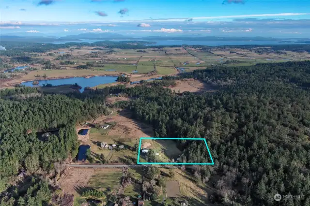 5.0 acres. Zylstra Lake in the distance. 50 gallon per minute shared well with neighbor that once owned this property.