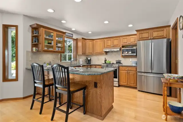 Kitchen with eat in bar, gas range and all stainless steel appliances. (all stay)