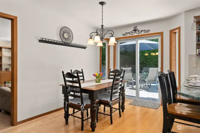 Room for second smaller dining space. Sliding glass doors behind dining set lead to beautiful, private deck space.