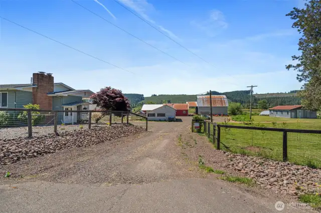 At the heart of this picturesque property stands a wonderful updated farmhouse, with charm and comfort. The welcoming entryway and low-maintenance front yard set the tone for relaxed country living. Perfectly suited for farming enthusiasts or those looking to embrace a self-sufficient lifestyle, the property is fully equipped to accommodate livestock of all kinds. This property offers a seamless blend of modern updates and rural functionality, making it a true haven for both people and animals alike