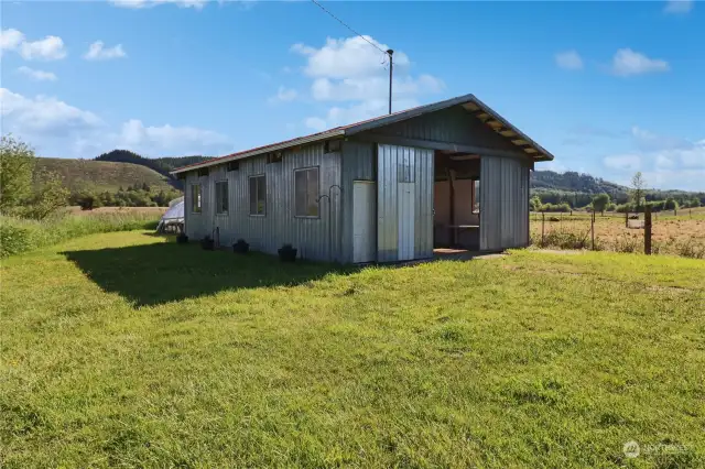 The green house is attached to this building so it could be the perfect building for storage and potting supplies.