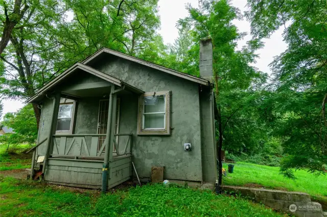 The existing house has 2 conforming bedrooms and 1 bathroom upstairs with a separate, non-conforming unit below with 3/4 bath. Both spaces have tenants paying monthly rent.