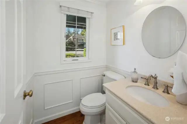 The powder room on the main level features custom wainscotting detail.