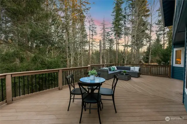 Enjoy ultimate backyard privacy on the expansive, custom deck.