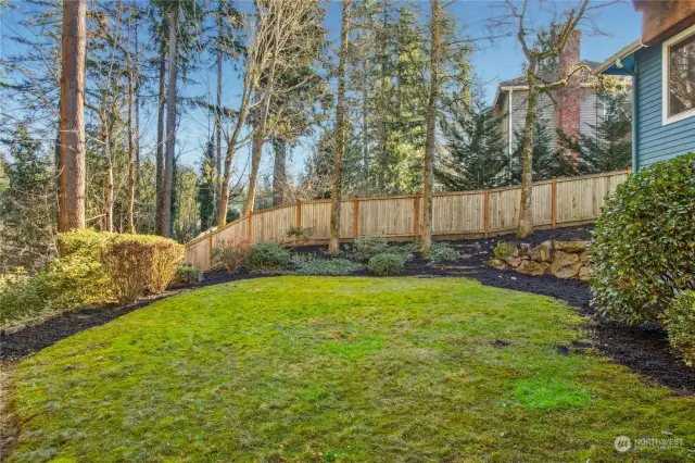 A lush, private backyard with plenty of room to run and play.