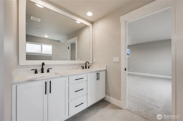 This photo of another floorplan to show sample finishes in primary bathroom vanity.  Detail will vary.