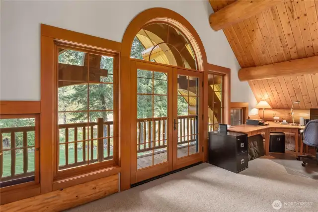 Stunning set of french doors with balcony in loft area.