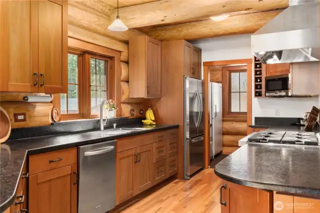 Beautiful soft close cherry cabinetry.
