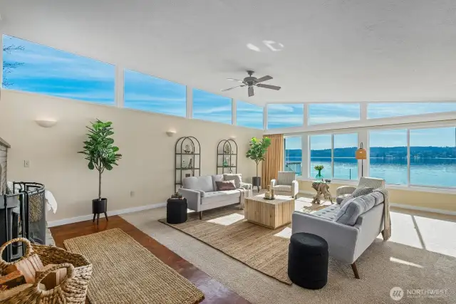 Bright, beachy, and wide open! Wall of windows brings the view right into your living room—perfect flow to the kitchen and dining too.