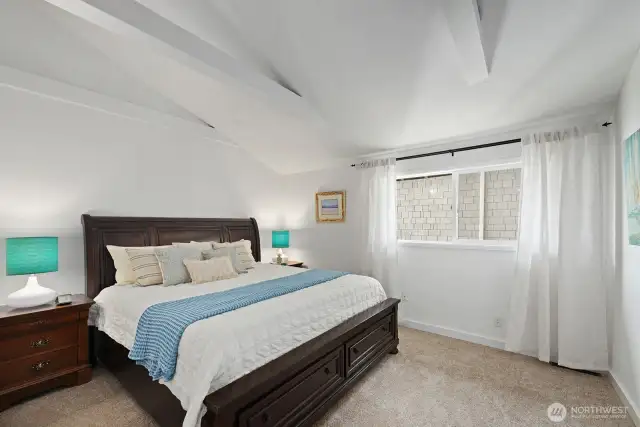 Second main level bedroom, privately situated for a restful and peaceful space.