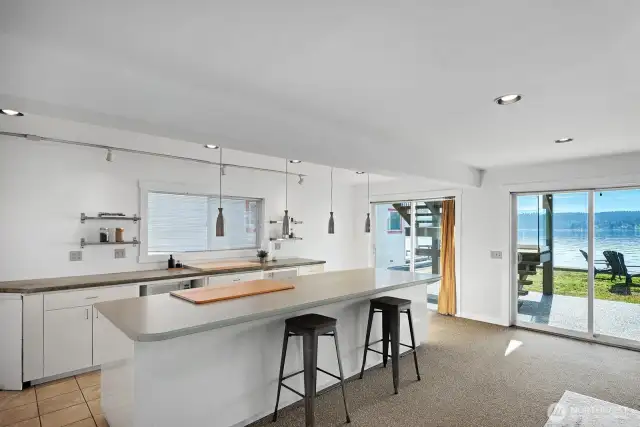 Room for everyone and everything. Downstairs has it all—wet bar, lounge space, bedrooms, game room, full bath & beach-ready changing room.
