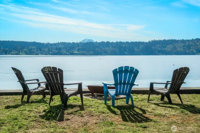 Can’t beat this view. Steps to the water, Mt. Rainier on the horizon, and your toes in the sand—every day.