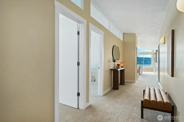 Start with a view. Step into the spacious hallway and be greeted by a stunning wall of windows showcasing the harbor and Mt. Rainier.