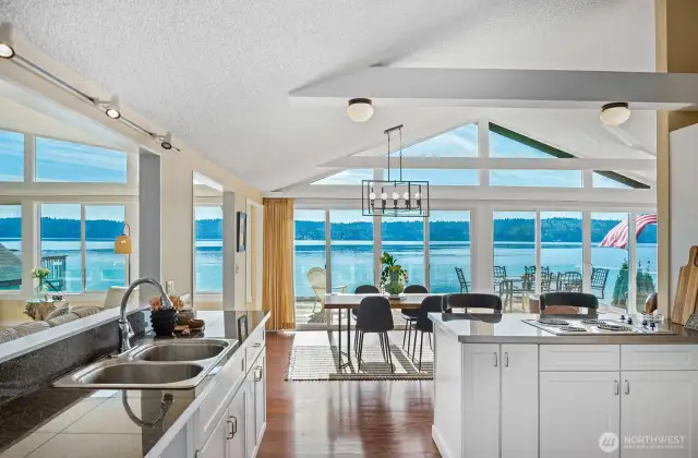 Open floor plan goals. Kitchen, dining, and living spaces all spill onto the deck with stunning beach views.