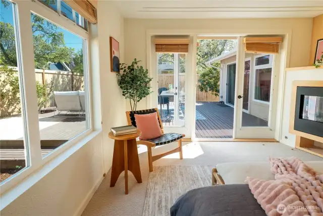 French doors open out to the back deck from this room as well as the kitchen area, and there is a second gas fireplace!