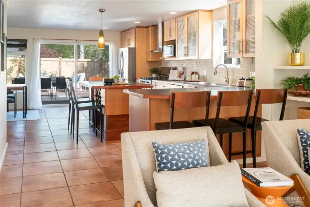Wide rooms, saltillo tiles, comfy breakfast bars - and sliding doors that open directly to the fenced back deck area