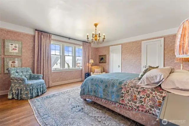Light & bright primary bedroom with dual closets and a peek-a-boo Sound view.