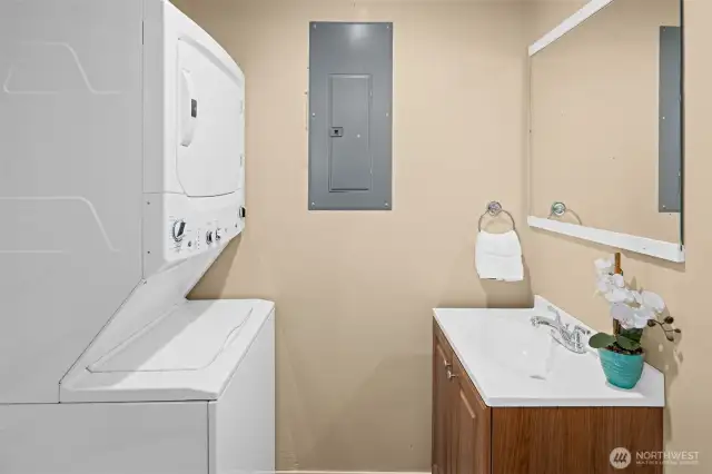 Guest half bathroom plus stacked washer & dryer.