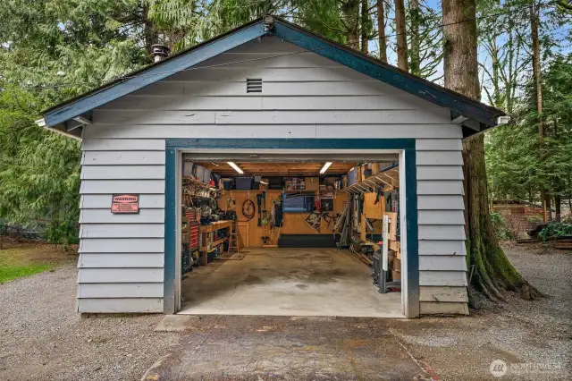 Incredible 16x24 shop/garage with electricity and wood stove.