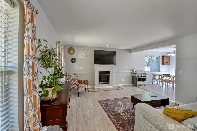 Spacious living room with gas fireplace.